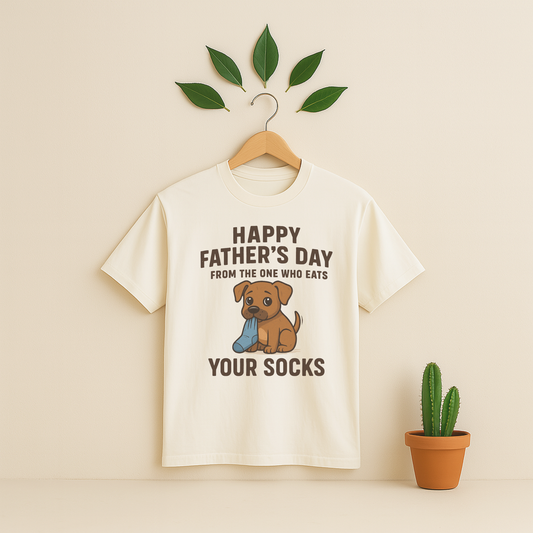 Ivory t-shirt with graphic antd text on a wooden hanger against a beige background with a cactus plant.
