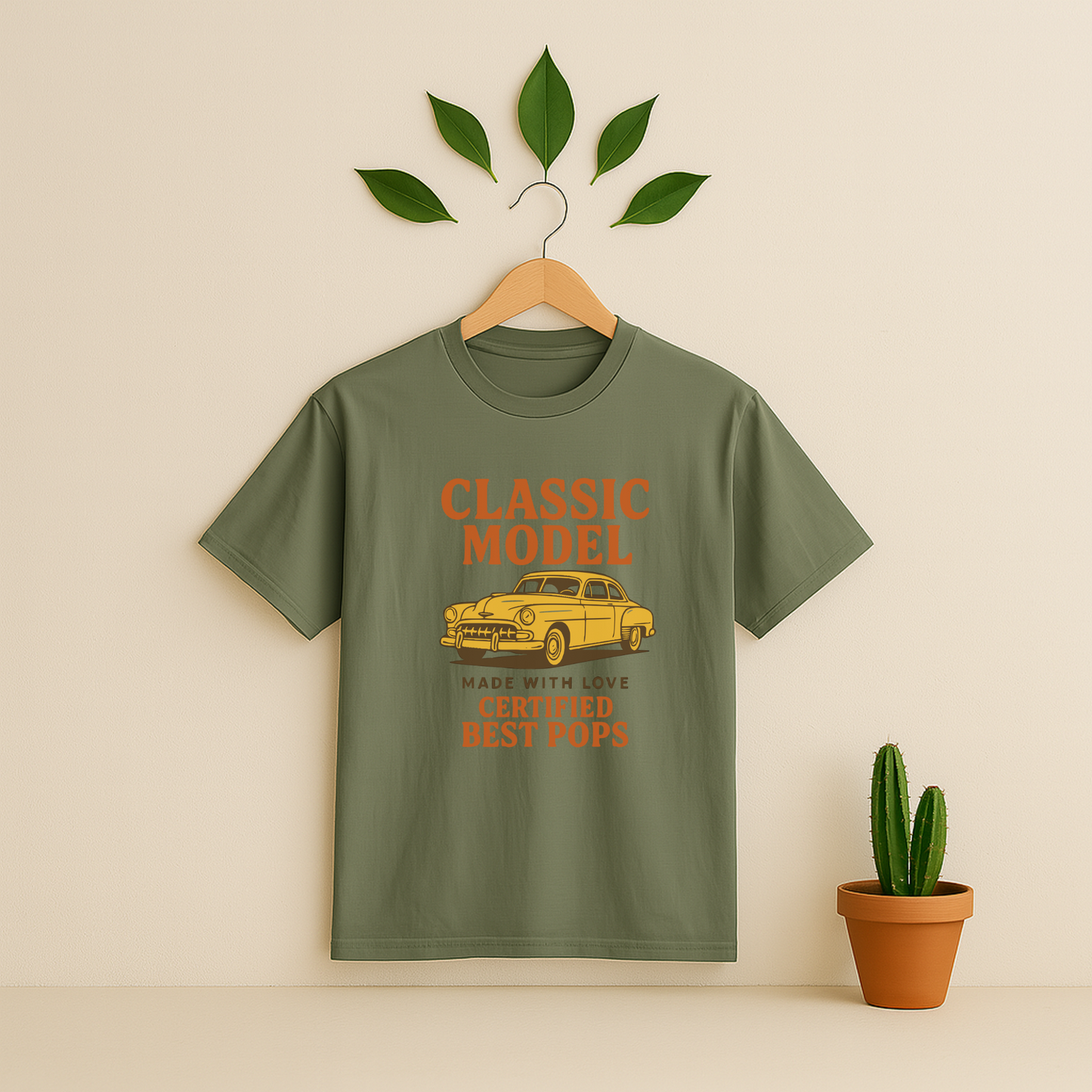 Moss t-shirt graphic and text on a wooden hanger against a beige background with a cactus plant.